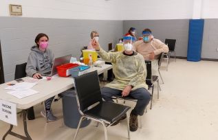 Dr. Peter Bell of the Sharbot Lake Family Health Team at a booser clinic in Sharbot Lake